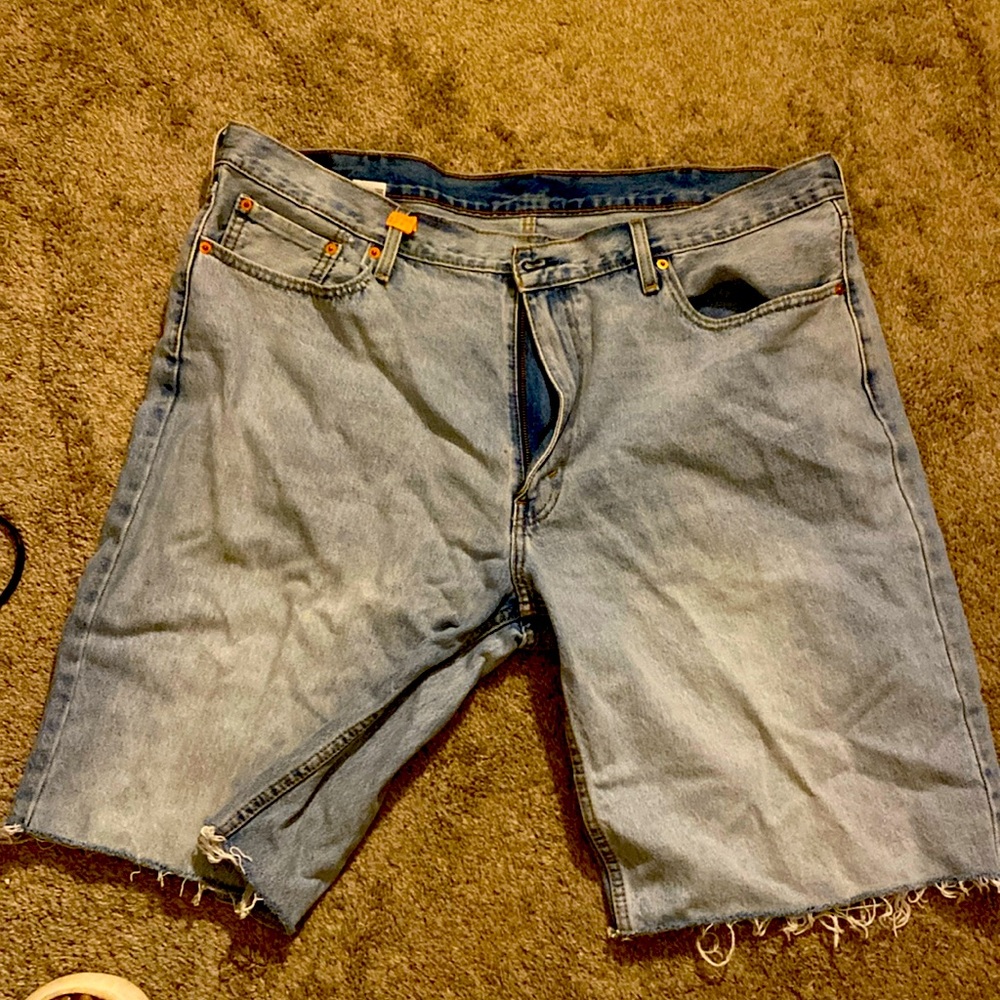 Levi’s frayed bottom shorts.